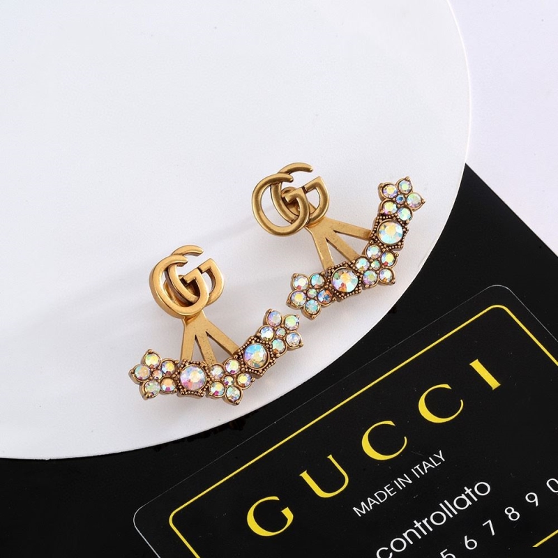 G*u*i earrings